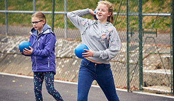 Outdoor Children Playing Dodgeball